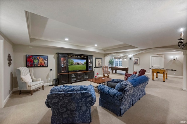 5198 Gardenia Ct, West Lafayette, IN 47906 - living area with arched walkways, carpet flooring, baseboards, a tray ceiling, and recessed lighting