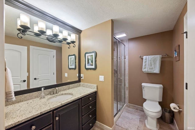 5198 Gardenia Ct, West Lafayette, IN 47906 - full bathroom with a stall shower, baseboards, toilet, vanity, and a textured ceiling