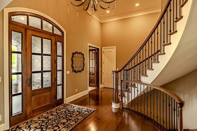5198 Gardenia Ct, West Lafayette, IN 47906 - entryway featuring a chandelier, baseboards, hardwood / wood-style flooring, crown molding, and stairs