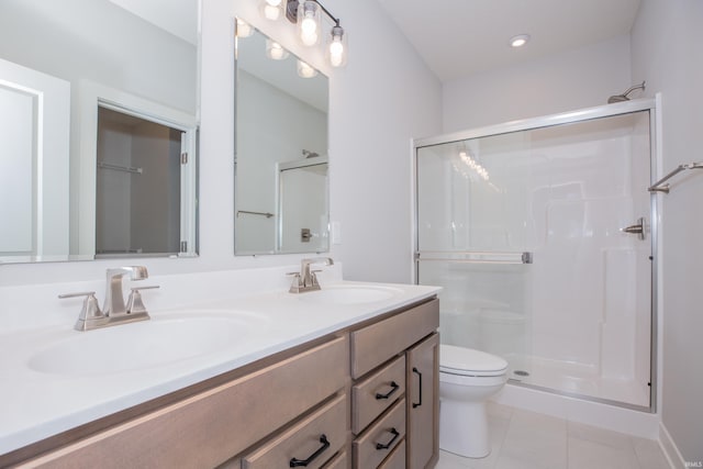 2934 Tipperary Dr, Evansville, IN 47725 - bathroom featuring toilet, a shower stall, double vanity, and tile patterned floors
