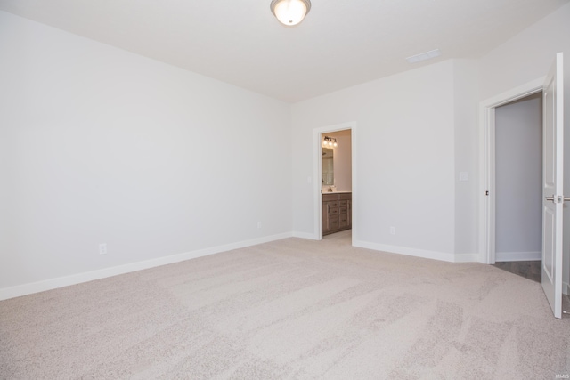 2934 Tipperary Dr, Evansville, IN 47725 - unfurnished bedroom with light colored carpet, baseboards, and ensuite bath