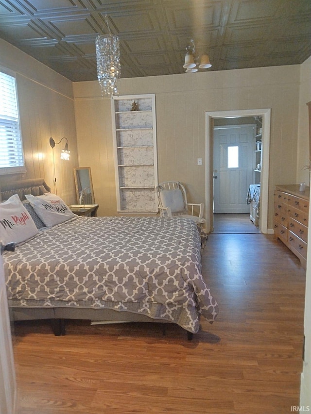 418 Watt St, Jeffersonville, IN 47130 - bedroom featuring an ornate ceiling, wood finished floors, and a chandelier