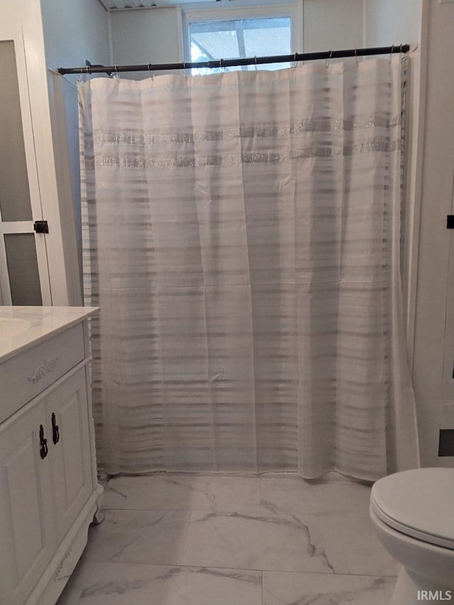 418 Watt St, Jeffersonville, IN 47130 - bathroom with marble look tile flooring, toilet, vanity, and a shower with curtain