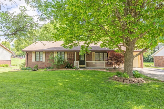 541 Genevieve Ave, Jasper, IN 47546 - ranch-style home featuring brick siding, a porch, concrete driveway, and a front yard