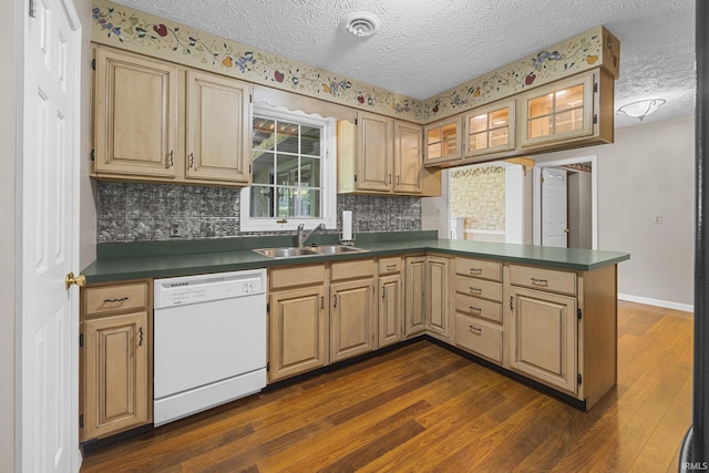 541 Genevieve Ave, Jasper, IN 47546 - kitchen with white dishwasher, a sink, a peninsula, a textured ceiling, and dark wood-style floors