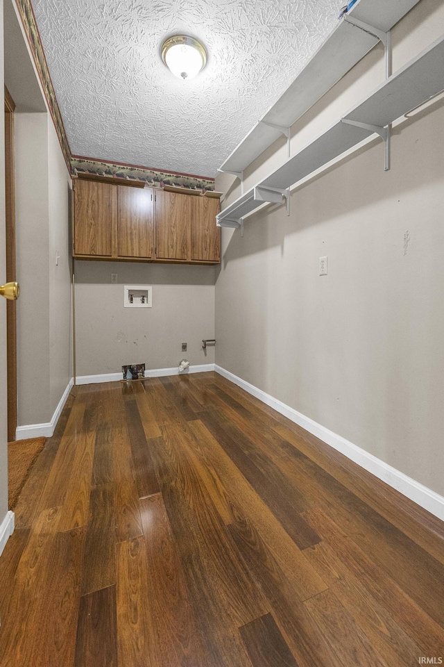 541 Genevieve Ave, Jasper, IN 47546 - clothes washing area featuring hookup for a gas dryer, hookup for a washing machine, dark wood-type flooring, baseboards, and a textured ceiling