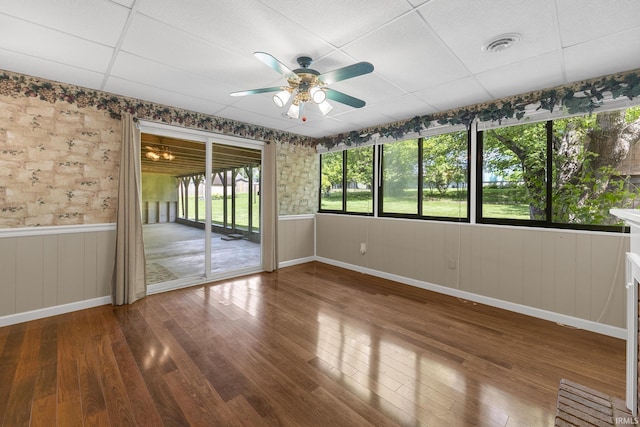541 Genevieve Ave, Jasper, IN 47546 - unfurnished room featuring wood finished floors, wainscoting, ceiling fan, a drop ceiling, and baseboards
