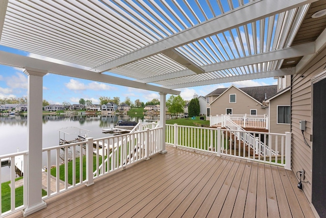 wooden terrace featuring boat lift, a dock, a water view, stairway, and a pergola