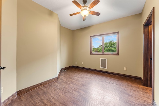 unfurnished bedroom with wood finished floors, baseboards, and a ceiling fan