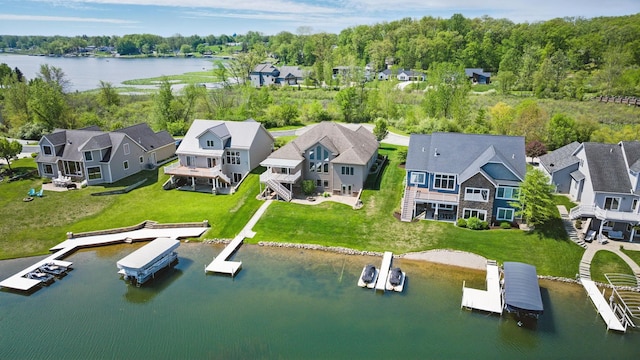 aerial perspective of suburban area featuring a large body of water