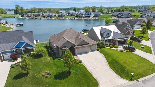 aerial perspective of suburban area featuring a nearby body of water