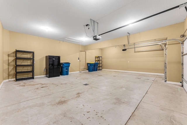 garage featuring a garage door opener and baseboards