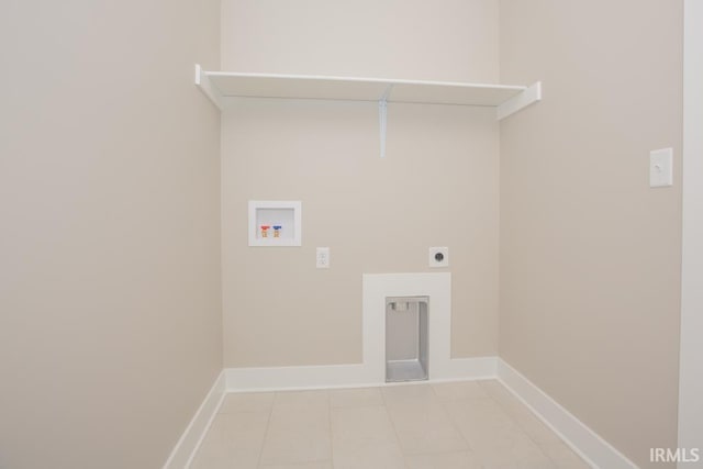 6968 Barlow Ct, Newburgh, IN 47630 - clothes washing area featuring hookup for a washing machine, hookup for an electric dryer, baseboards, and light tile patterned floors