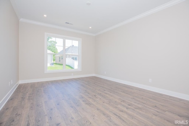 6968 Barlow Ct, Newburgh, IN 47630 - empty room with ornamental molding, wood finished floors, baseboards, and recessed lighting