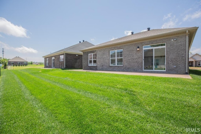 6968 Barlow Ct, Newburgh, IN 47630 - back of house featuring a yard, brick siding, and a patio area