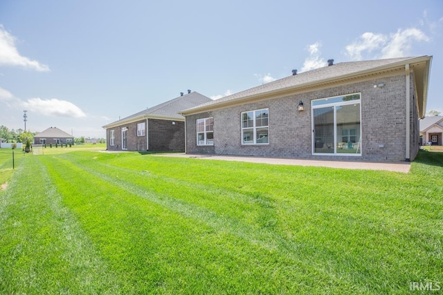 6968 Barlow Ct, Newburgh, IN 47630 - back of house featuring brick siding, a yard, and a patio area