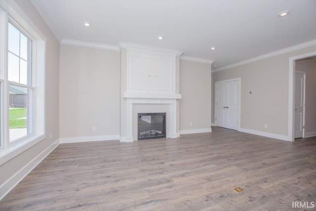 6968 Barlow Ct, Newburgh, IN 47630 - unfurnished living room with crown molding, a brick fireplace, wood finished floors, baseboards, and recessed lighting
