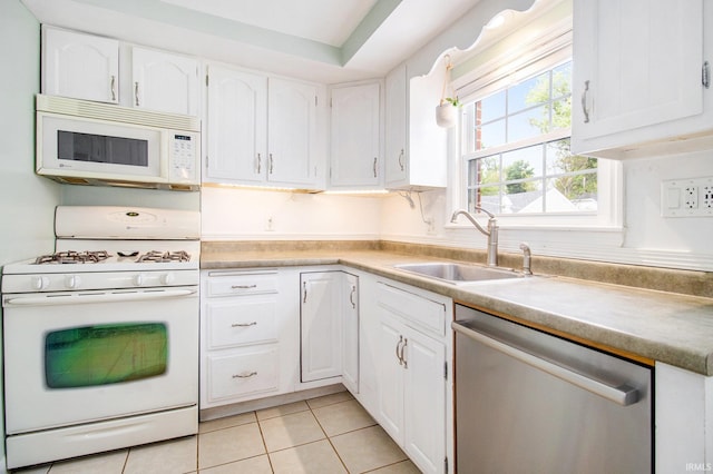 423 N Esther St, South Bend, IN 46617 - kitchen featuring white appliances, a sink, white cabinetry, and light tile patterned floors