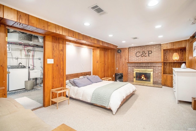 423 N Esther St, South Bend, IN 46617 - carpeted bedroom with washer / clothes dryer, wooden walls, recessed lighting, a fireplace, and a sink