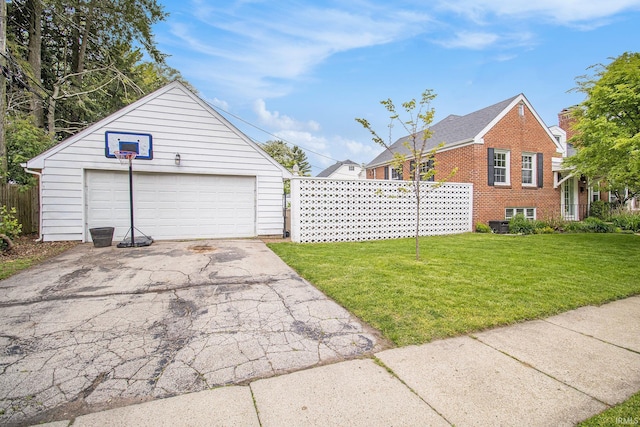 423 N Esther St, South Bend, IN 46617 - view of property exterior with a detached garage, an outbuilding, and brick siding