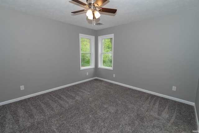 3214 Burr Oak Ave, Elkhart, IN 46517 - spare room with dark carpet, baseboards, and ceiling fan