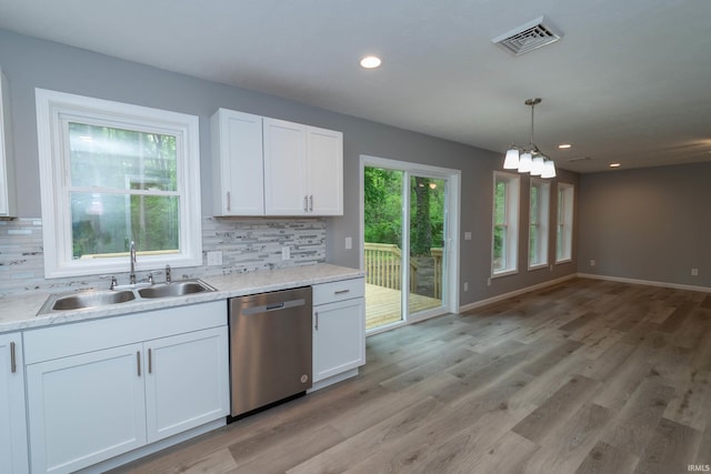 3214 Burr Oak Ave, Elkhart, IN 46517 - kitchen with dishwasher, a sink, decorative backsplash, white cabinetry, and recessed lighting