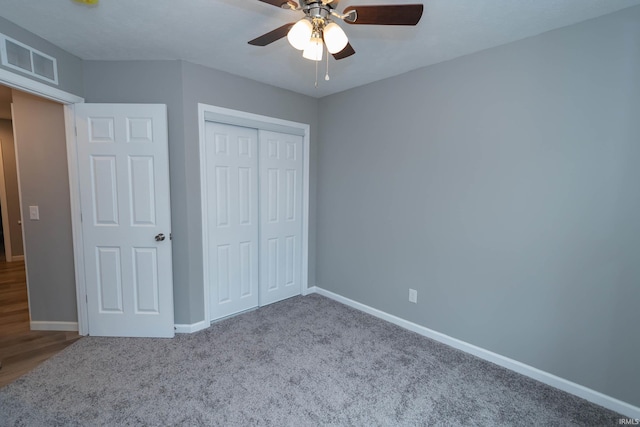 3214 Burr Oak Ave, Elkhart, IN 46517 - unfurnished bedroom featuring baseboards, a closet, carpet flooring, and a ceiling fan