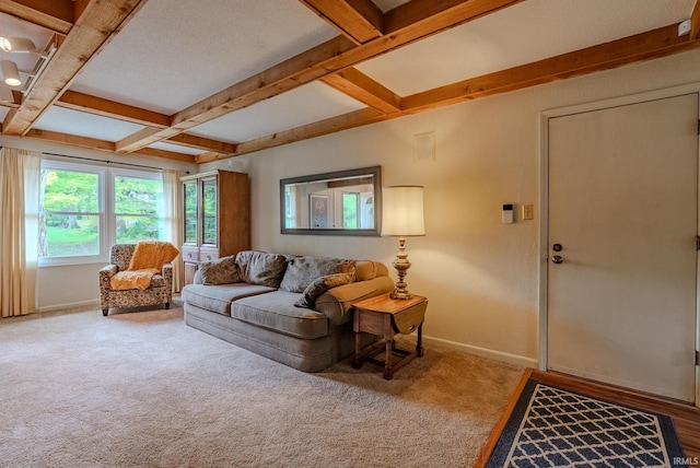 living room with beamed ceiling, coffered ceiling, baseboards, and carpet floors