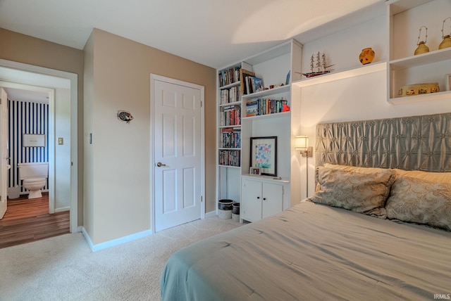 bedroom featuring carpet flooring and baseboards