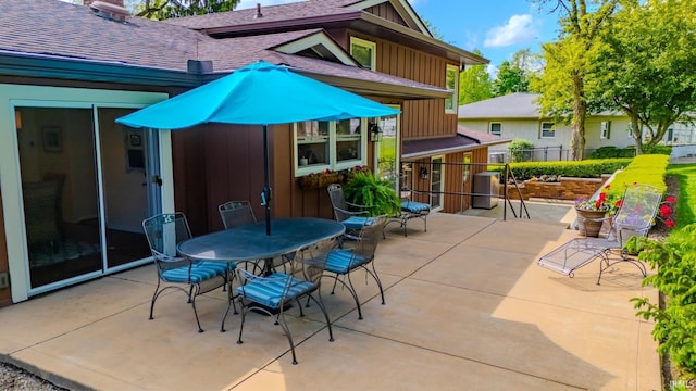 view of patio / terrace featuring fence and outdoor dining area