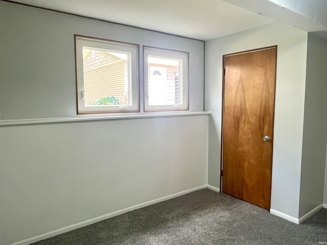 unfurnished bedroom featuring carpet flooring and baseboards