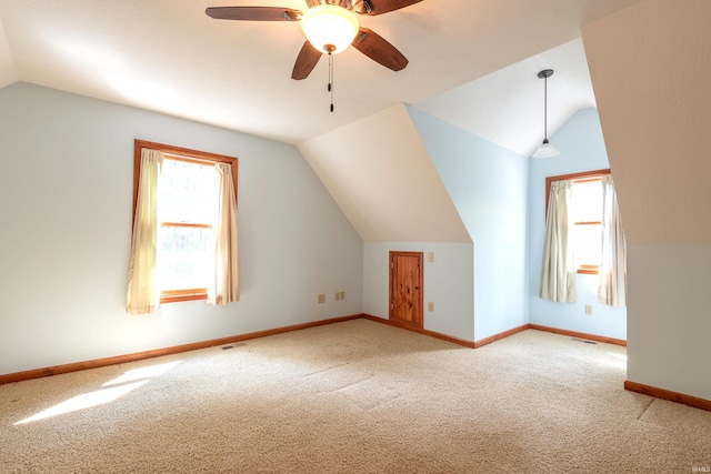 6015 E State Road 46, Bloomington, IN 47401 - bonus room featuring vaulted ceiling, carpet, healthy amount of natural light, and baseboards