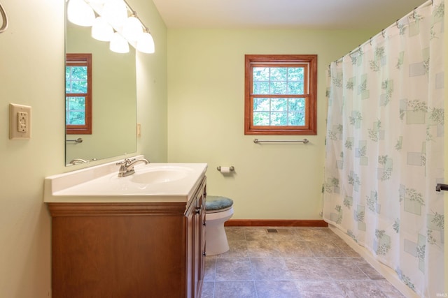 6015 E State Road 46, Bloomington, IN 47401 - full bathroom featuring baseboards, vanity, toilet, and curtained shower
