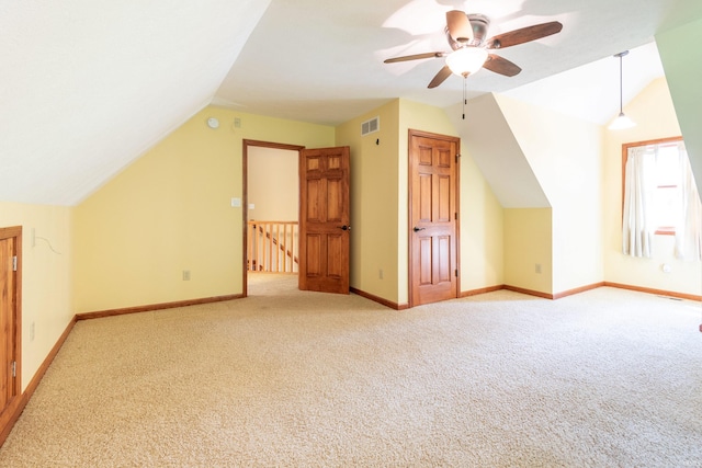 6015 E State Road 46, Bloomington, IN 47401 - bonus room featuring lofted ceiling, light carpet, a ceiling fan, and baseboards