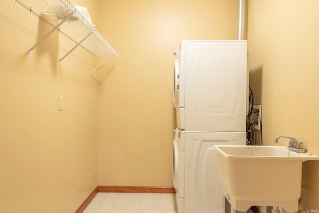 6015 E State Road 46, Bloomington, IN 47401 - laundry area with stacked washer / drying machine and baseboards