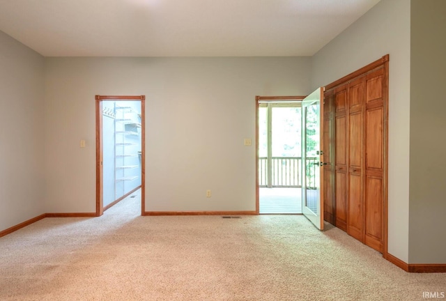 6015 E State Road 46, Bloomington, IN 47401 - spare room with light carpet and baseboards