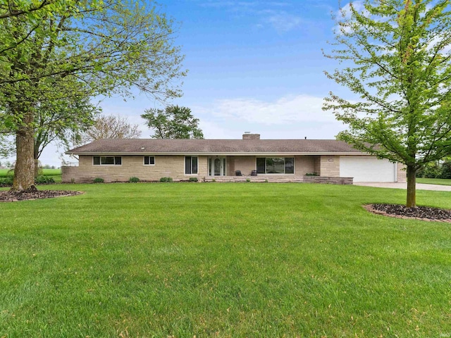 4038 Fahlsing Rd, Woodburn, IN 46797 - ranch-style house featuring a garage, stone siding, driveway, and a front lawn