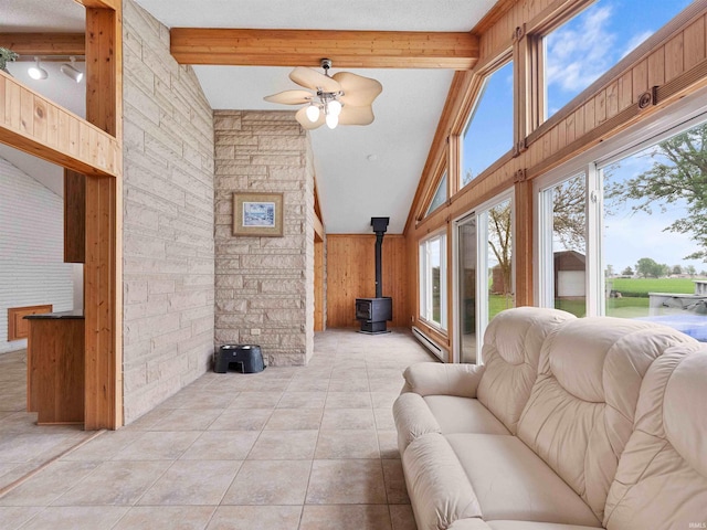 4038 Fahlsing Rd, Woodburn, IN 46797 - sunroom / solarium featuring a wood stove and baseboard heating