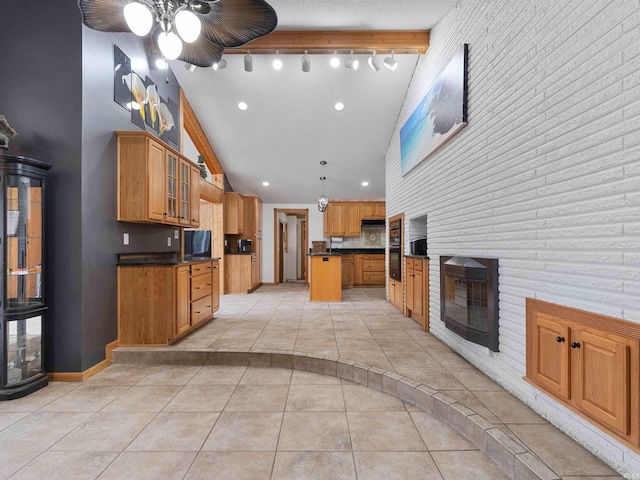 4038 Fahlsing Rd, Woodburn, IN 46797 - kitchen featuring dark countertops, glass insert cabinets, light tile patterned floors, a kitchen island, and recessed lighting