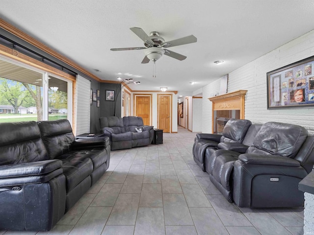 4038 Fahlsing Rd, Woodburn, IN 46797 - living room with a ceiling fan, tile patterned flooring, and brick wall