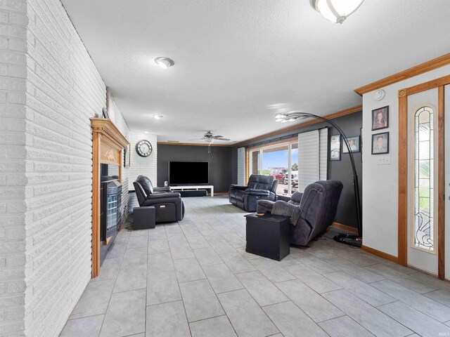 4038 Fahlsing Rd, Woodburn, IN 46797 - living room with a fireplace, a textured ceiling, light tile patterned flooring, baseboards, and a ceiling fan