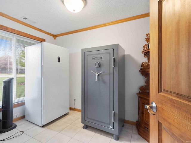 4038 Fahlsing Rd, Woodburn, IN 46797 - interior space featuring ornamental molding, freestanding refrigerator, a textured ceiling, and baseboards