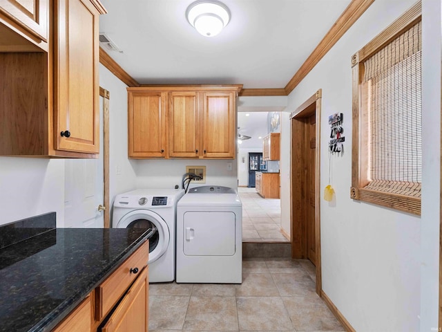 4038 Fahlsing Rd, Woodburn, IN 46797 - clothes washing area featuring washer and dryer, cabinet space, ornamental molding, and light tile patterned floors