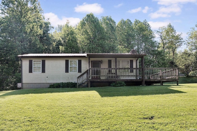 view of front of property with a front yard, metal roof, and covered porch