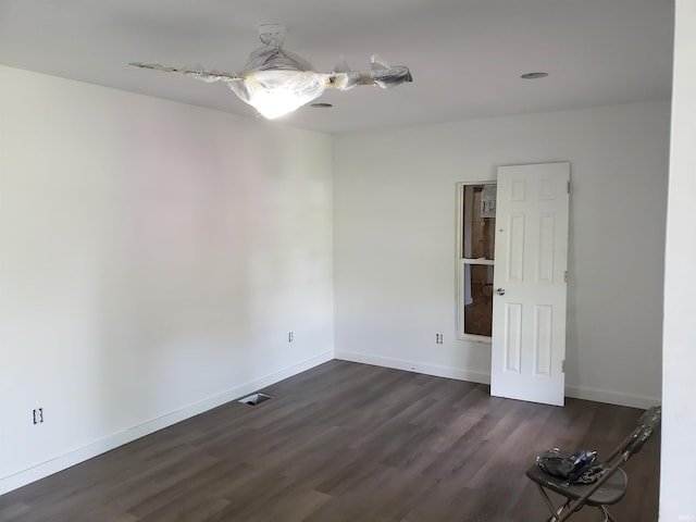3644 N Parker Ave, Indianapolis, IN 46218 - empty room featuring dark wood finished floors and baseboards
