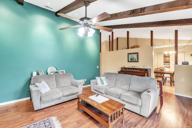 9126 Redfield Dr, Fort Wayne, IN 46819 - living area with a ceiling fan, baseboards, wood finished floors, and a chandelier