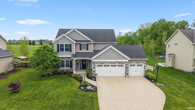 craftsman inspired home with an attached garage, driveway, and stone siding