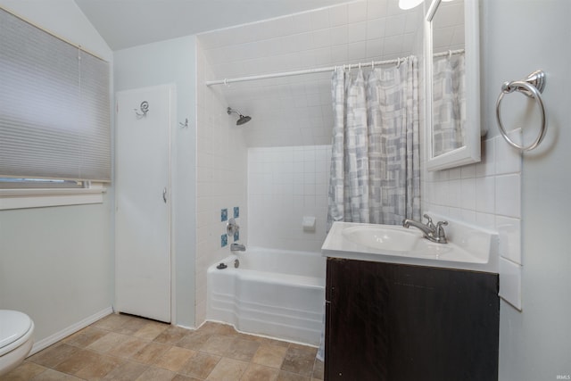 bathroom with toilet, shower / tub combo, and vanity