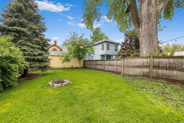 view of yard with an outdoor fire pit