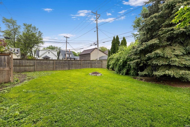 view of yard with an outdoor fire pit